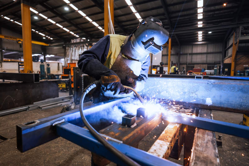 Welder building a custom railing