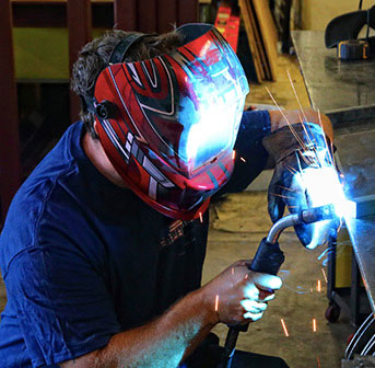 Welder working on a custom railing